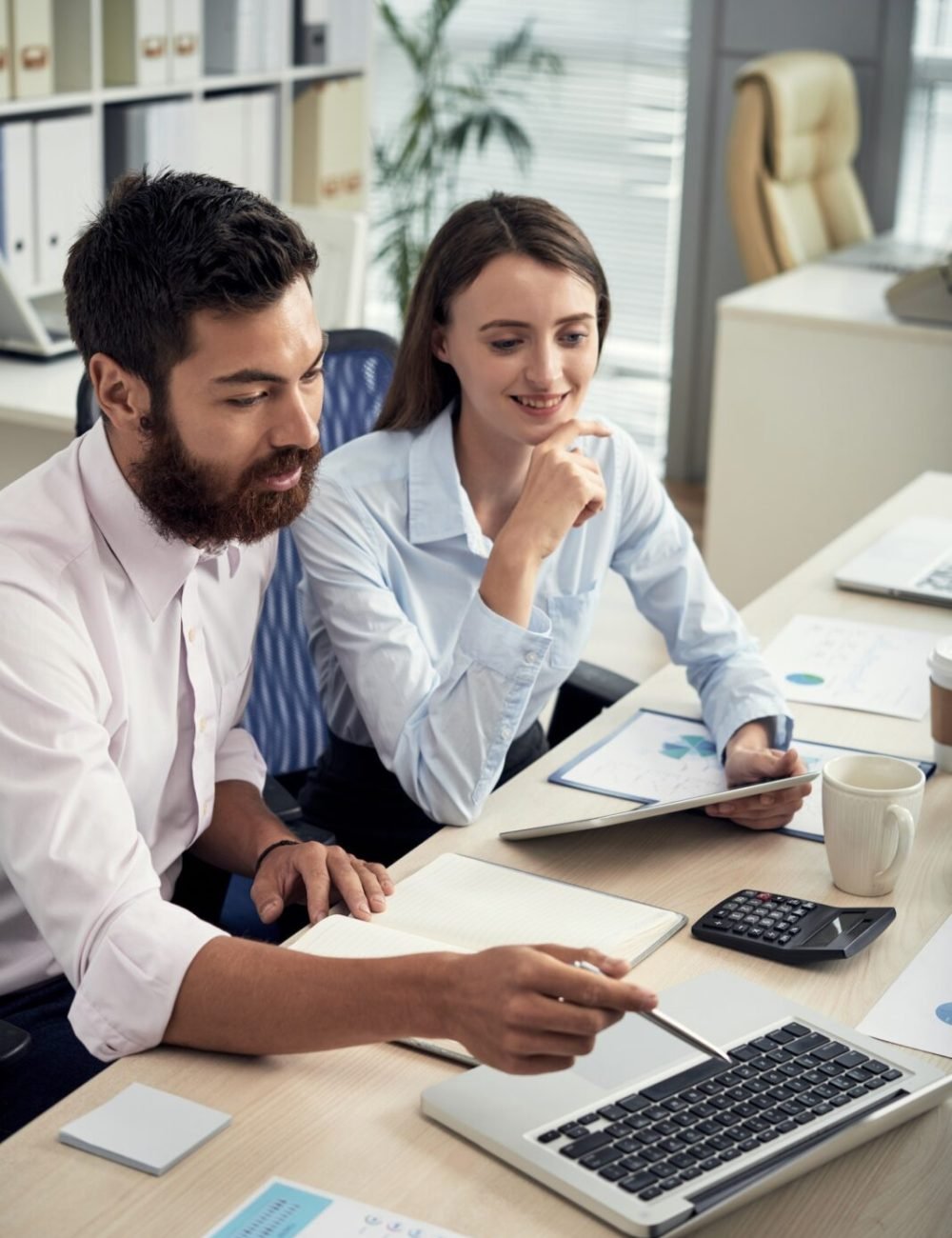 A man and a woman having a meeting about finance.